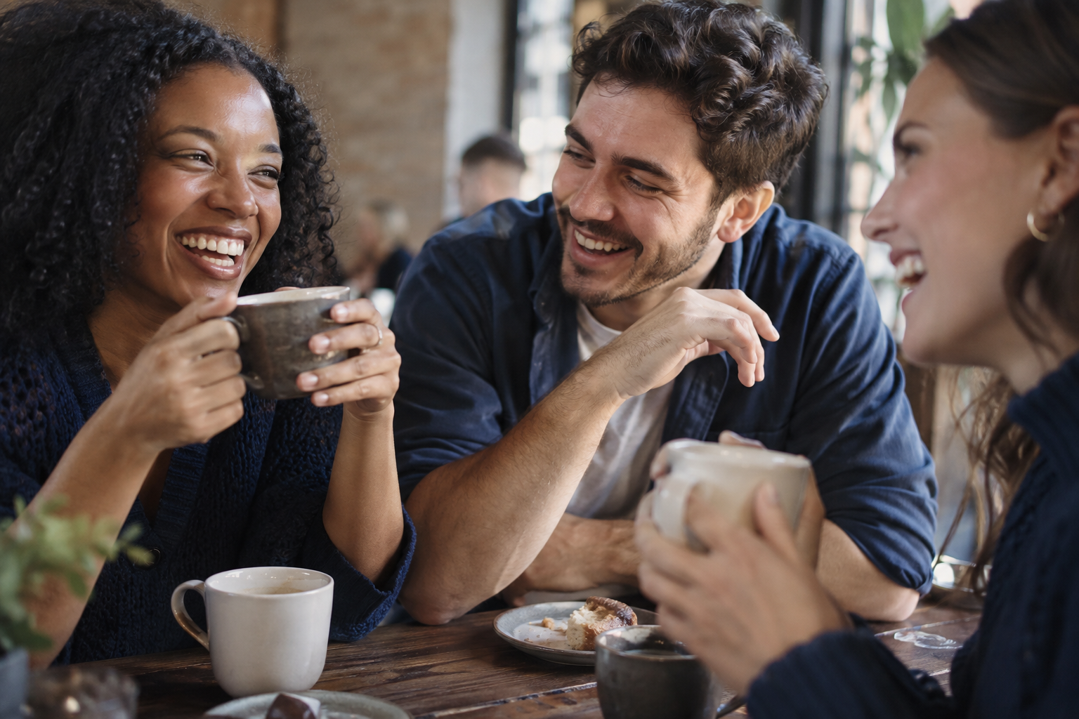 Friends sharing a laugh over coffee